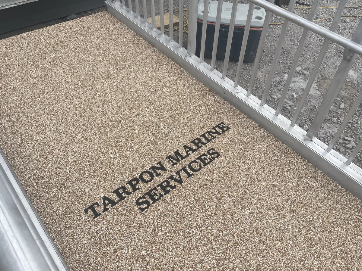 Commercial logo inlay on a marine deck